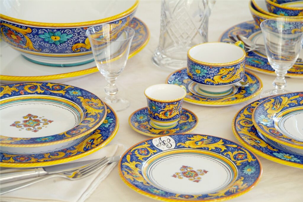 A table set with the Raffaellesco Blu dinnerware by L'Antica Deruta. Handmade in Deruta, Italy