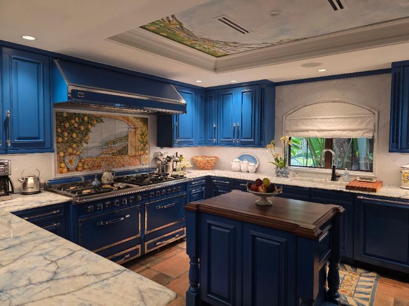 Stunning kitchen renovation project featuring a hand-painted Italian backsplash and a frescoed ceiling